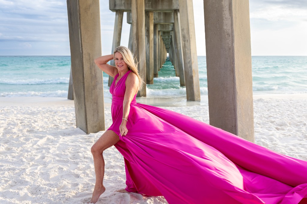 Donna Lewis in a pink flying dress beneath the Juno Beach pier