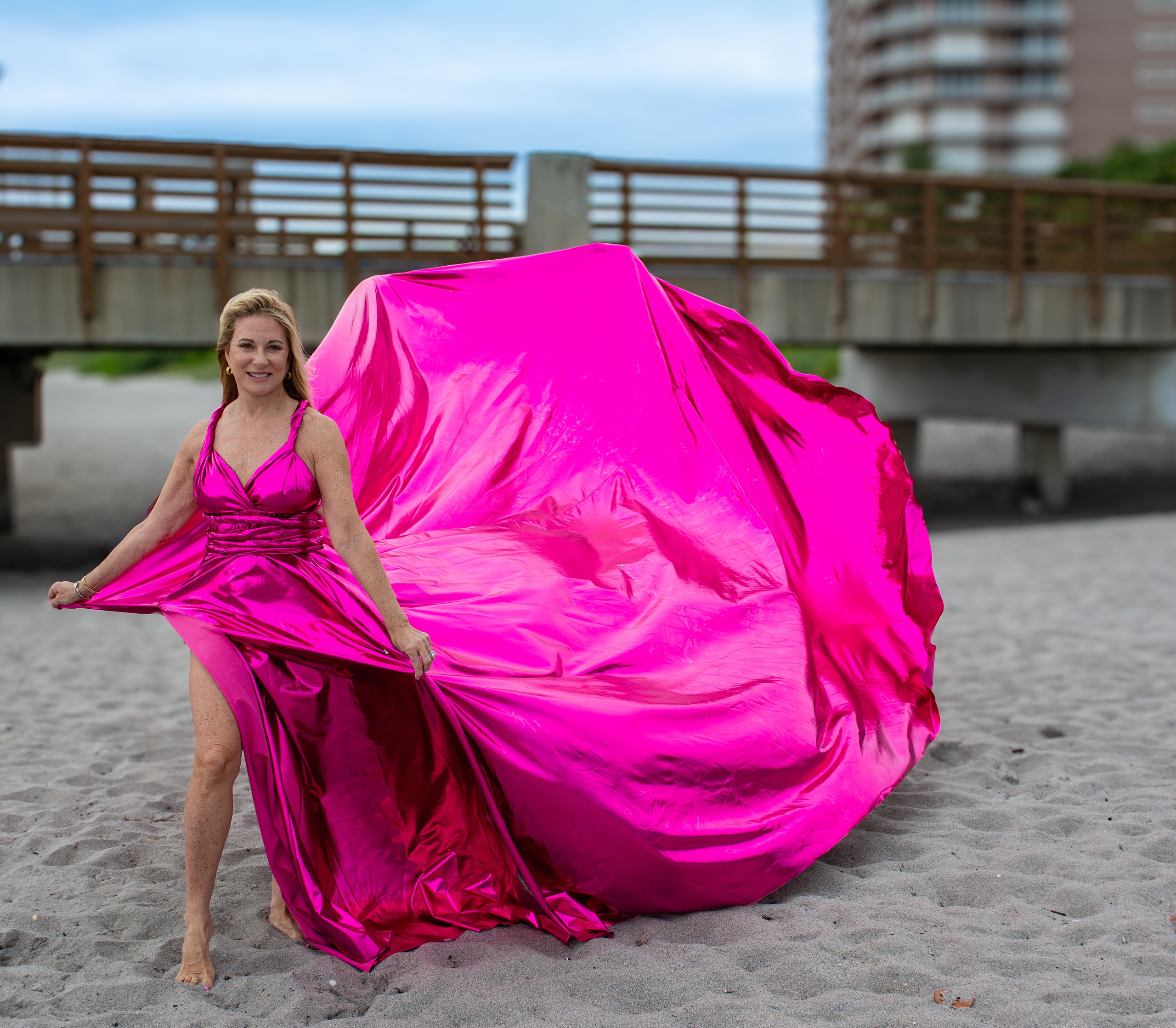 Flying dress photoshoot at Coral Cove Park — royal blue gown on the rocks