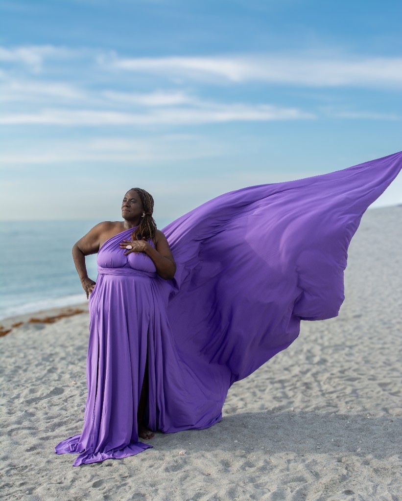 Flying dress photoshoot on the beach — purple gown with flowing train